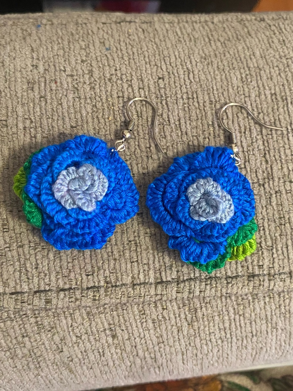 Handmade Blue Crochet Flower Earrings with Green Accents